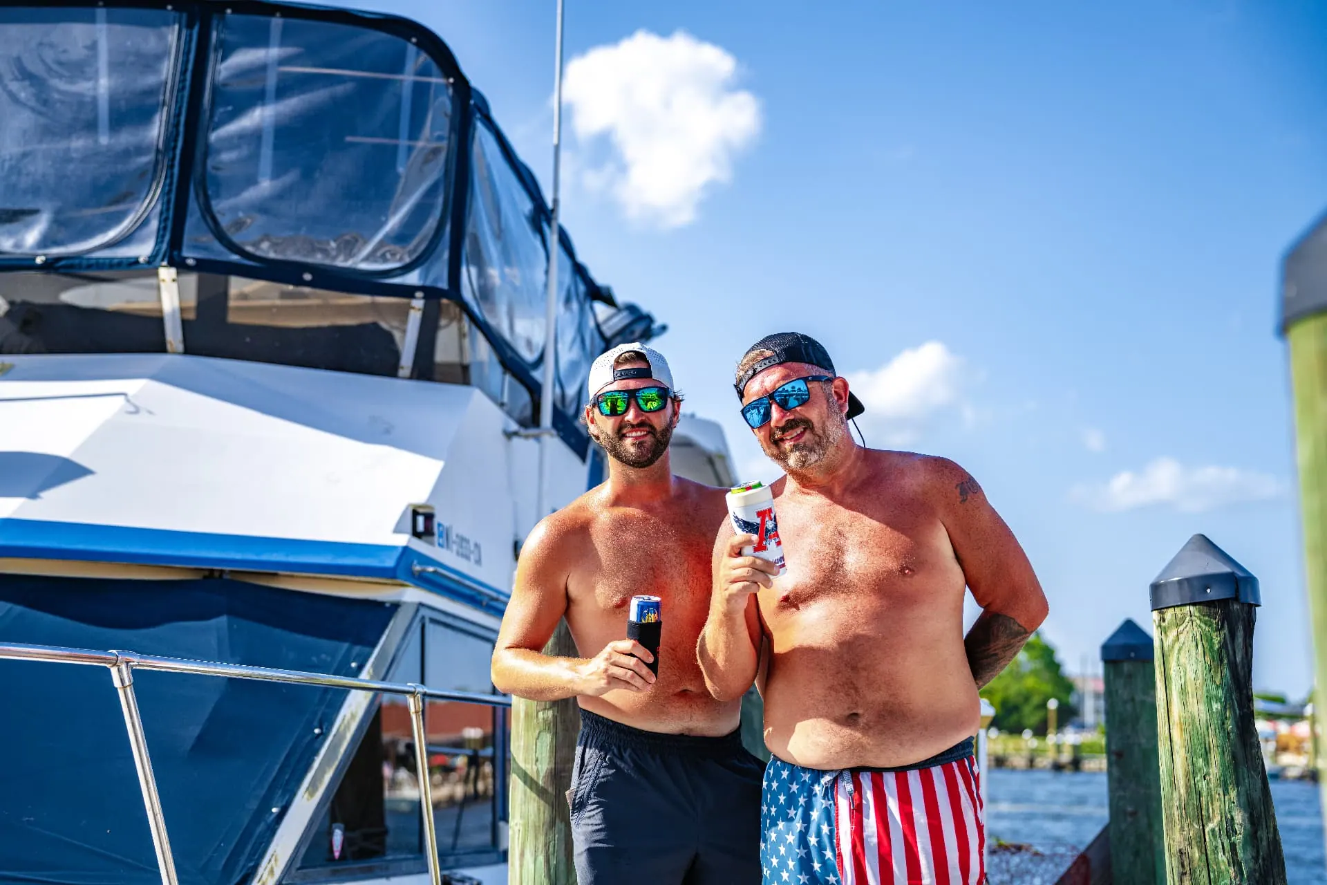 Guests enjoying a sunny day on their boat at the marina