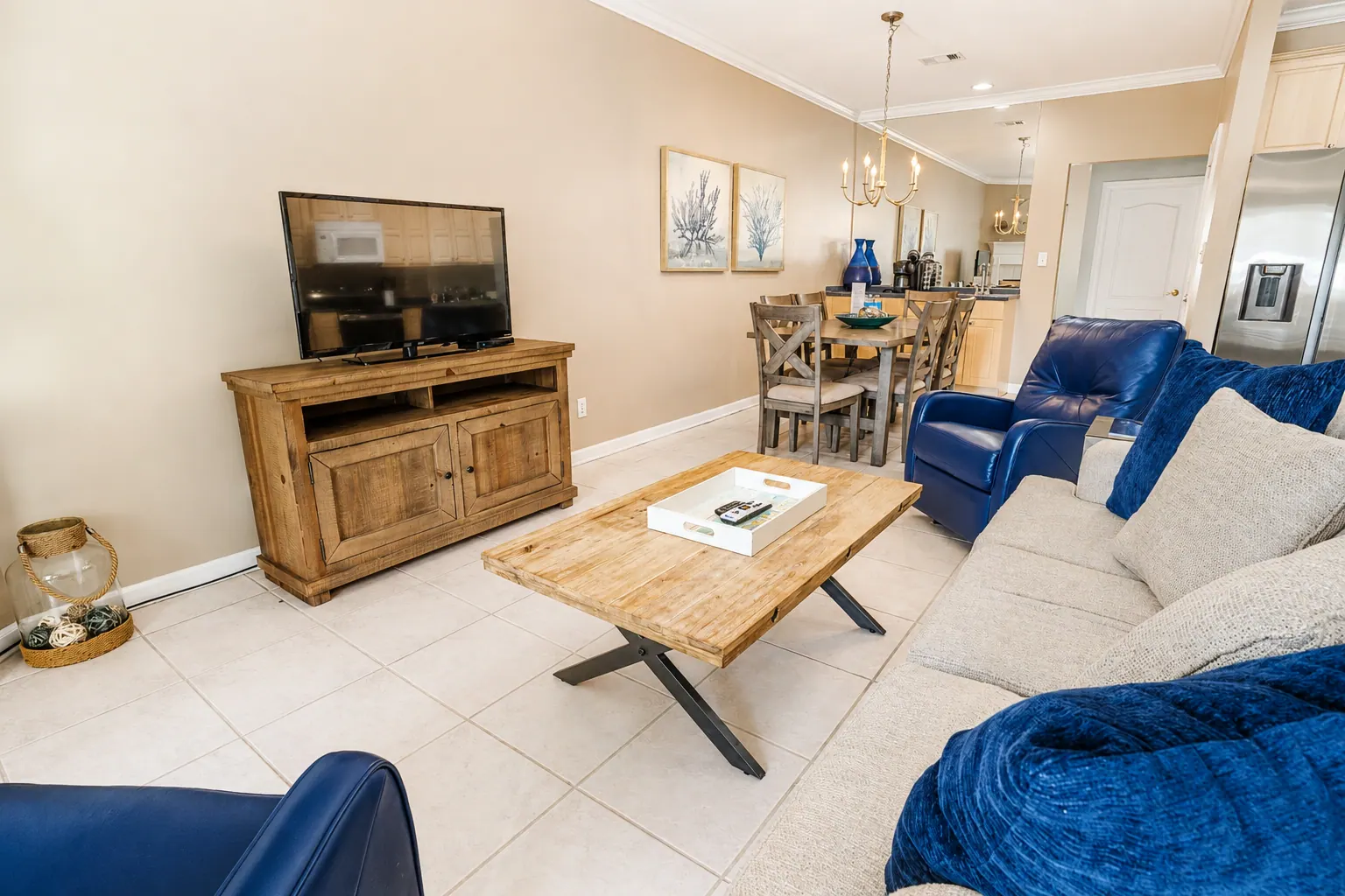 Bright open-plan living and dining area inside a furnished luxury condo