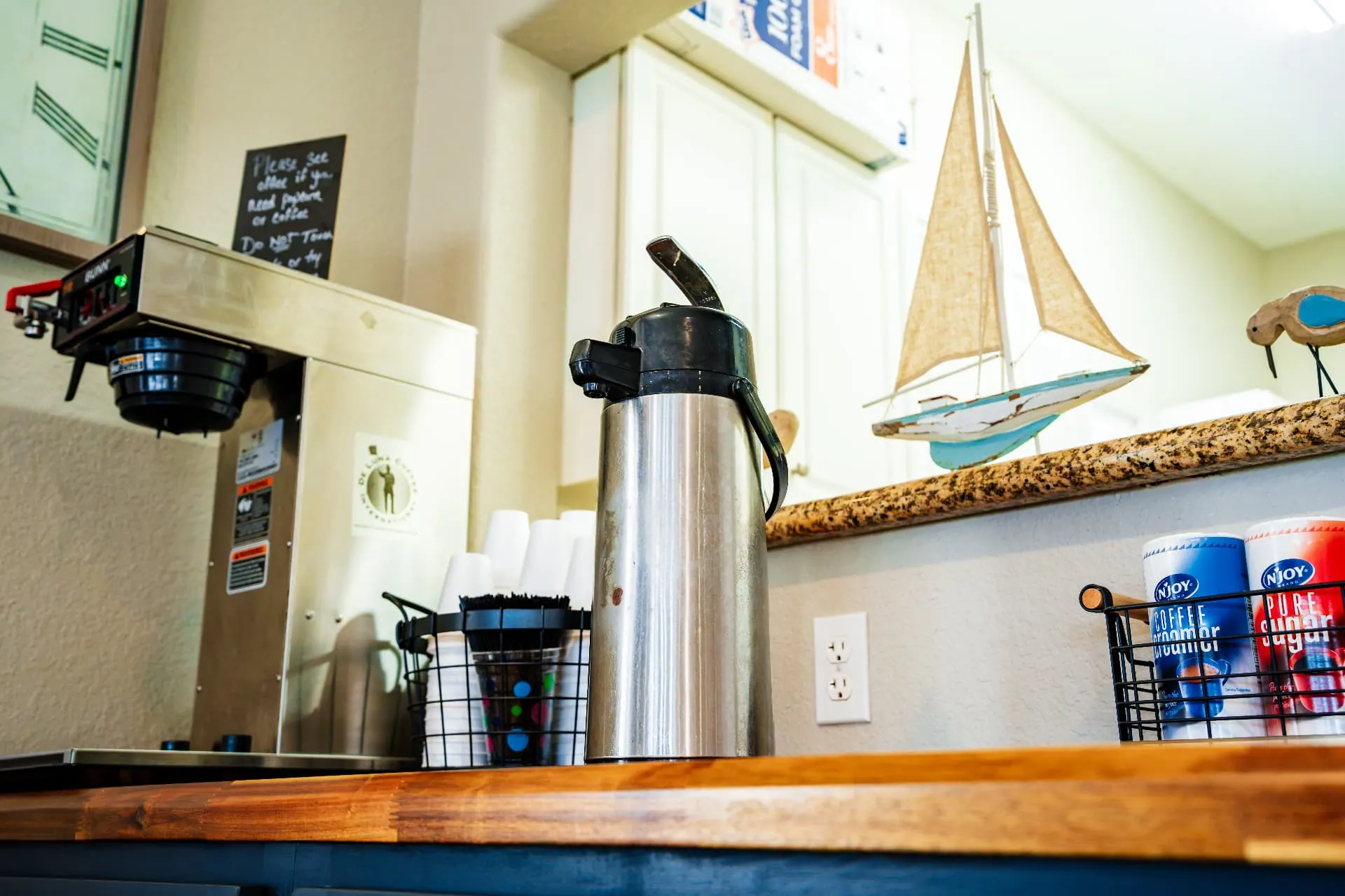 Clubhouse coffee bar with fresh brewed coffee and supplies